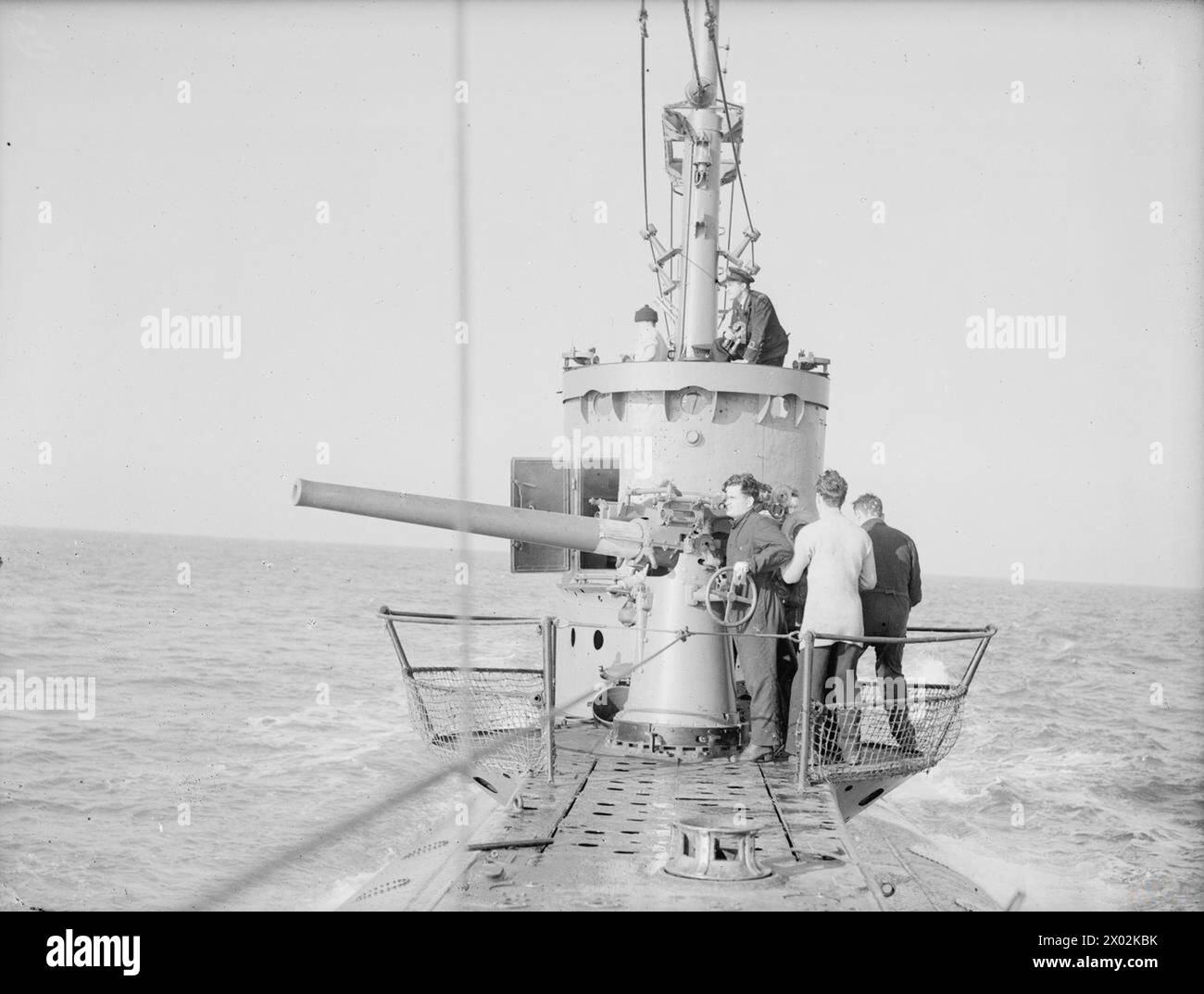 THE SUBMARINE HMS SUNFISH TRIES OUT HER GUNS. 4 NOVEMBER 1943