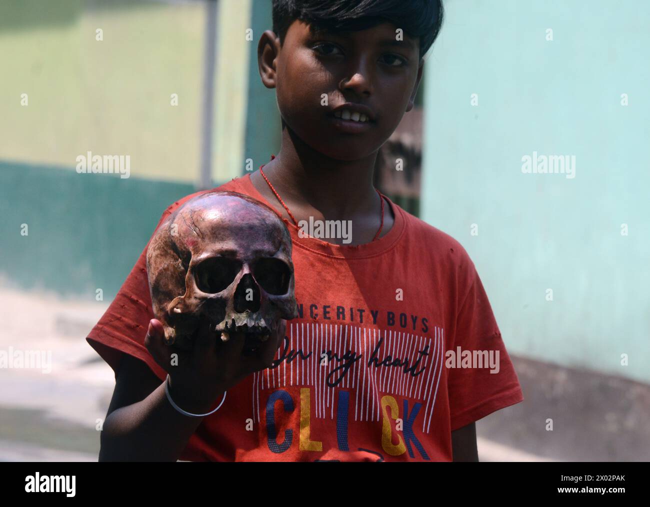 April 9, 2024, Siliguri, West Bengal, India An Indian child holds a