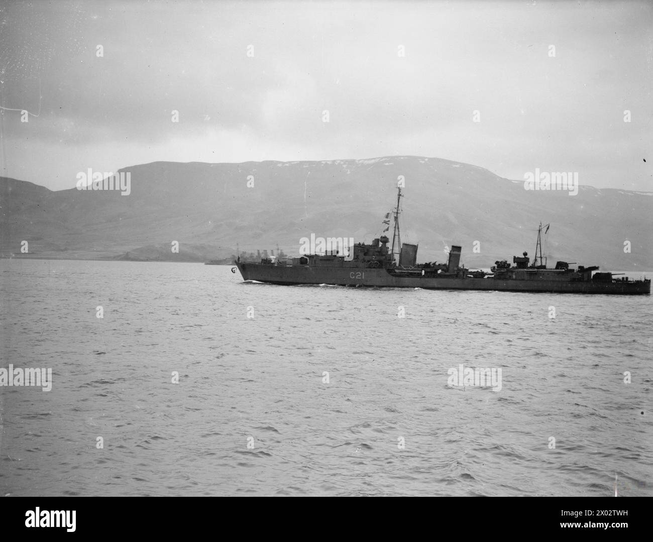 SHIPS AT HVALFJORD, ICELAND. 19 AND 20 NOVEMBER 1941, ON BOARD THE AIRCRAFT CARRIER HMS VICTORIOUS. - The Tribal class destroyer HMS PUNJABI  Royal Navy, HMS Puttenham, Minesweeper, (1956) Stock Photo