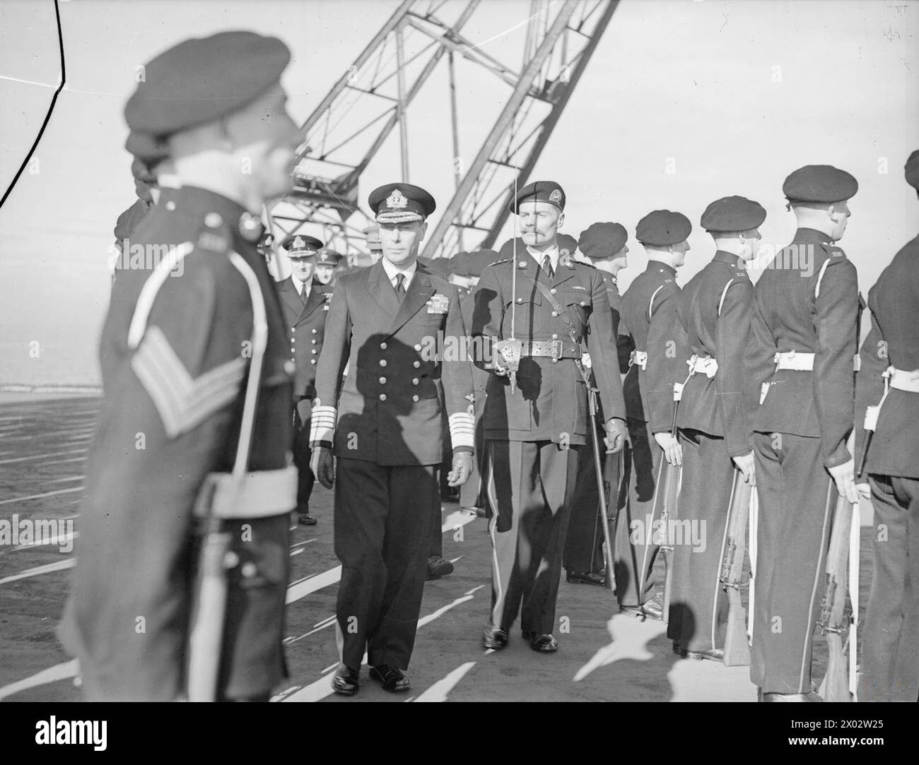 ROYAL VISIT TO THE IMPLACABLE. 9 MARCH 1945, ON BOARD THE CARRIER HMS ...