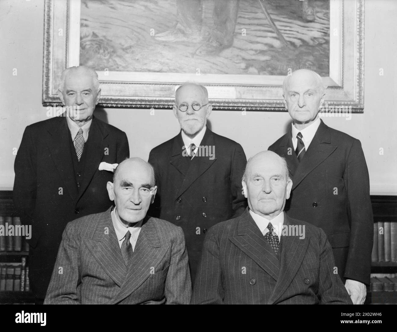 FIVE 1883 NAVAL CADETS CELEBRATE DIAMOND JUBILEE. 31 AUGUST 1943, UNITED SERVICE CLUB, PALL MALL. FIVE OF THE NINE SURVIVING OFFICERS OF THE TEAM OF 35 THAT JOINED HMS BRITANNIA, THE PREDECESSOR OF THE ROYAL NAVAL COLLEGE DARTMOUTH, AS NAVAL CADETS ON AUGUST 31, 1883, HELD A DIAMOND JUBILEE REUNION DINNER. - Group (left to right) seated: Admiral of the Fleet Sir Reginald Tyrwhitt, Bart, GCB, DSO, and Admiral Sir Richard Webb, KCMG, CB. Left to right, standing: Capt O V de Satge, RN (Ret), Capt J R Le H Ward, CBE, RN (Ret), and Capt H T A Bosanquet, CVO, RN Stock Photo