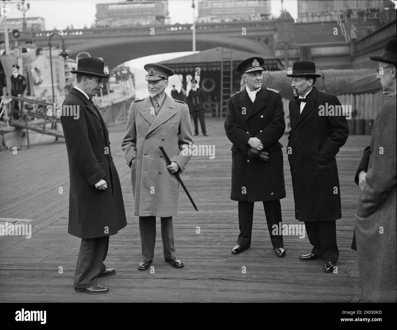 EMPIRE PREMIERS SAIL DOWN THE THAMES TO DINNER. 8 MAY 1944, WESTMINSTER PIER. EMPIRE PREMIERS LEAVING BY ML EN ROUTE FOR THE ROYAL NAVAL COLLEGE, GREENWICH, TO ATTEND THE DINNER GIVEN IN THEIR HONOUR BY THE BOARD OF ADMIRALTY. - Left to right: Lord Cranborne, Secretary of State for Dominion Affairs; Field Marshal Smuts; Vice Admiral Sir E Neville Syfret; Mr C Atlee, Deputy Prime Minister Stock Photo