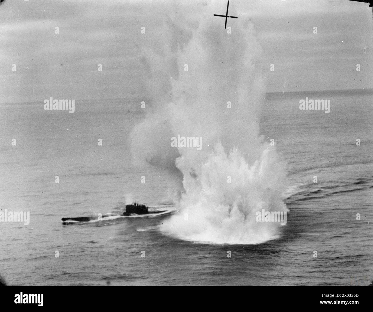 ROYAL AIR FORCE COASTAL COMMAND, 1939-1945. - Low-level oblique photograph taken from Short Sunderland Mark III, EK591 'U', of No. 422 Squadron RCAF while attacking German type VIIC submarine U-625 in the Atlantic Ocean. Depth charges dropped by EK591 explode around the stern of the U-boat (right), while machine-gun fire from the Sunderland's rear gunner straddles the bows and conning tower (left). U-625 submerged shortly after, only to resurface three minutes later in a damaged condition  Royal Canadian Air Force, 422 Squadron, German Navy (Third Reich), U-625 Stock Photo