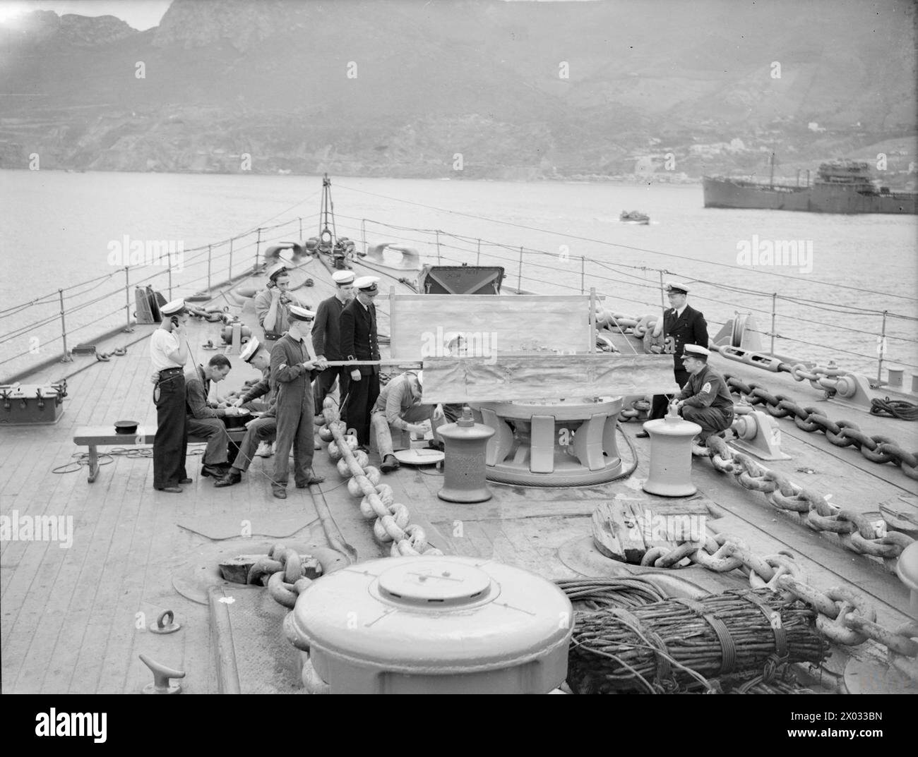 On HMS Rodney in March 1943, gunnery crews use a spotting table with ...