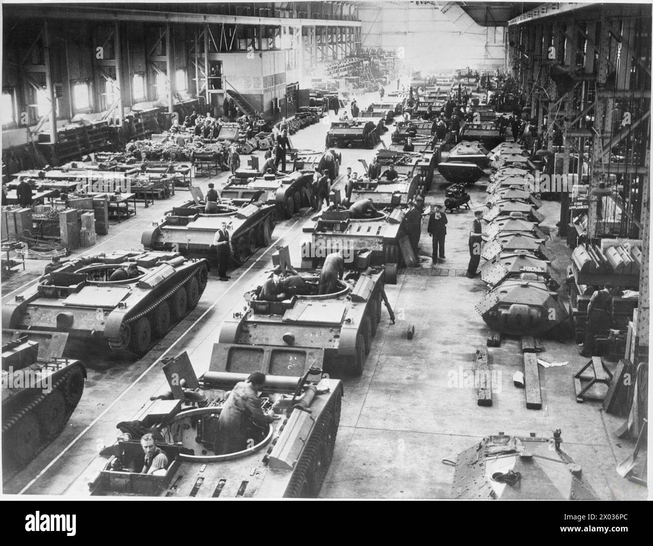 Covenanter tanks are shown at various stages of assembly on a factory ...