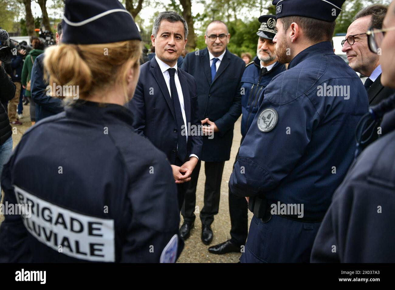 French Interior and Overseas Minister Gerald Darmanin (C) meets with