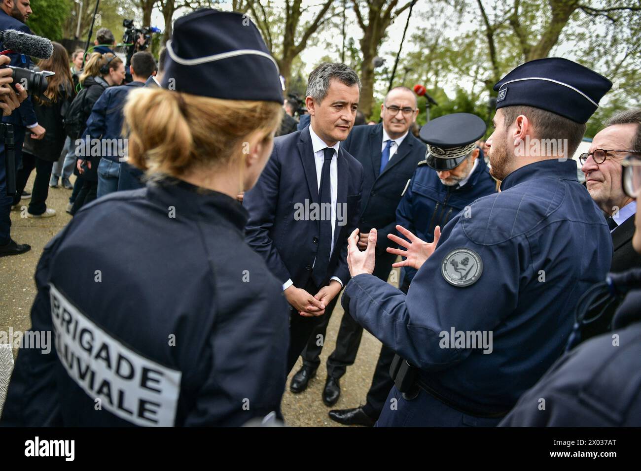French Interior and Overseas Minister Gerald Darmanin (C) meets with