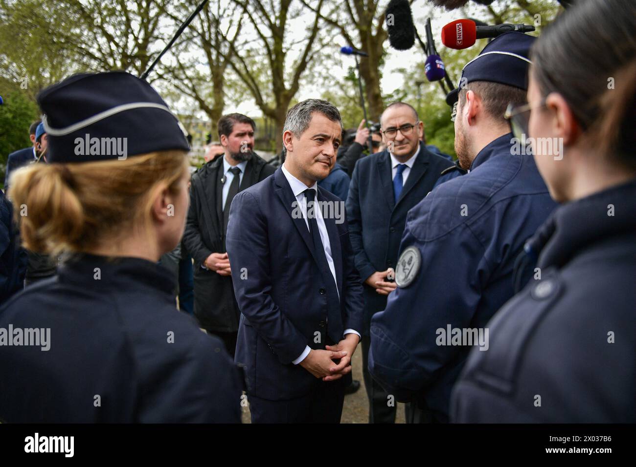 French Interior and Overseas Minister Gerald Darmanin (C) meets with