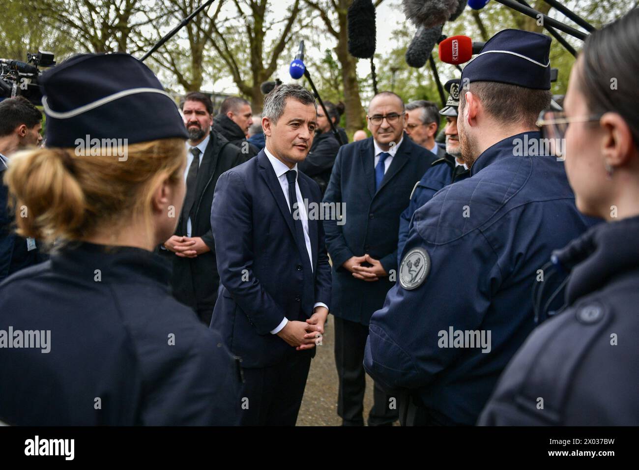 French Interior and Overseas Minister Gerald Darmanin (C) meets with
