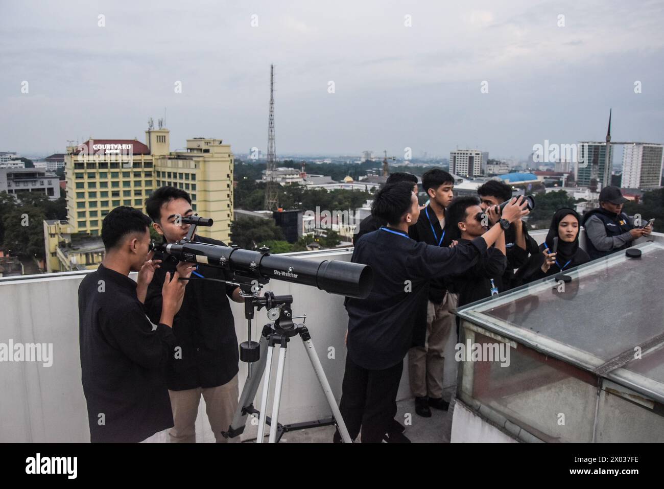 Observatory staff perform rukyatul hilal using a crescent moon sighting telescope at sunset marking the end of the holy month of Ramadan, at Albiruni Unisba Observatory in Bandung, West Java, Indonesia, on April 9, 2024. (Photo by Dimas Rachmatsyah/Sipa USA) Credit: Sipa USA/Alamy Live News Stock Photo