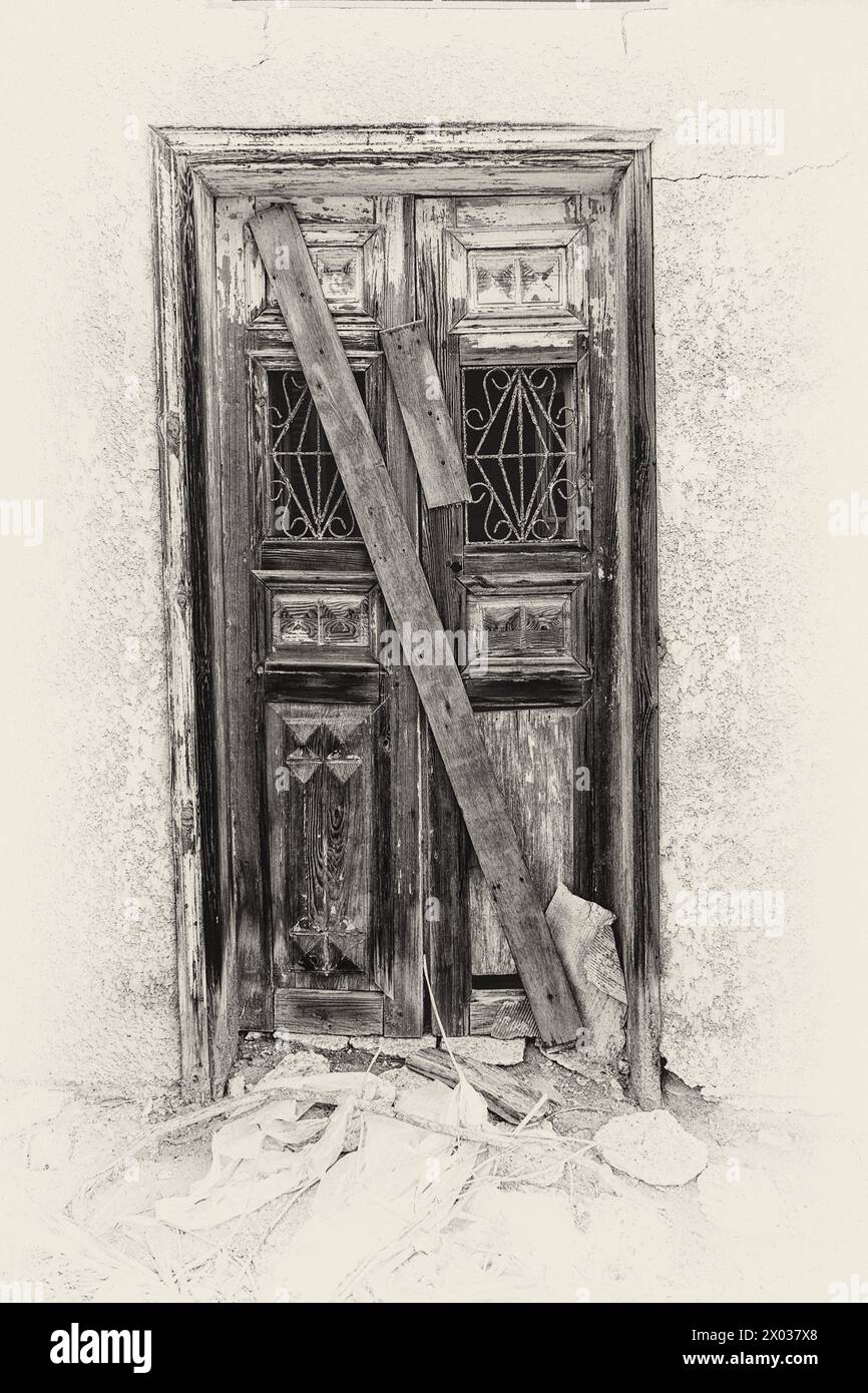 A filtered image of a boarded up entrance to a derelict Arabian house. Stock Photo