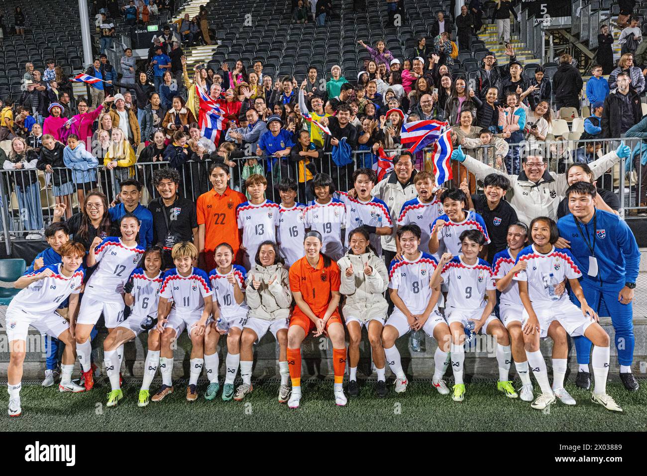 Christchurch, New Zealand, April 9th 2024: The Thailand women's team pose for a photo with their supporters after drawing nil-nil with New Zealand in the second friendly international between New Zealand and Thailand at the Apollo Projects Stadium in Christchurch, New Zealand. Credit: James Foy / Alamy Live News Stock Photo