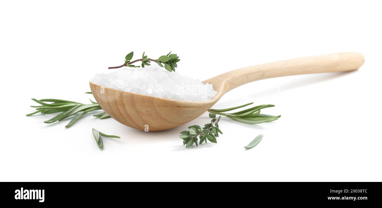 Salt with herbs in spoon isolated on white Stock Photo
