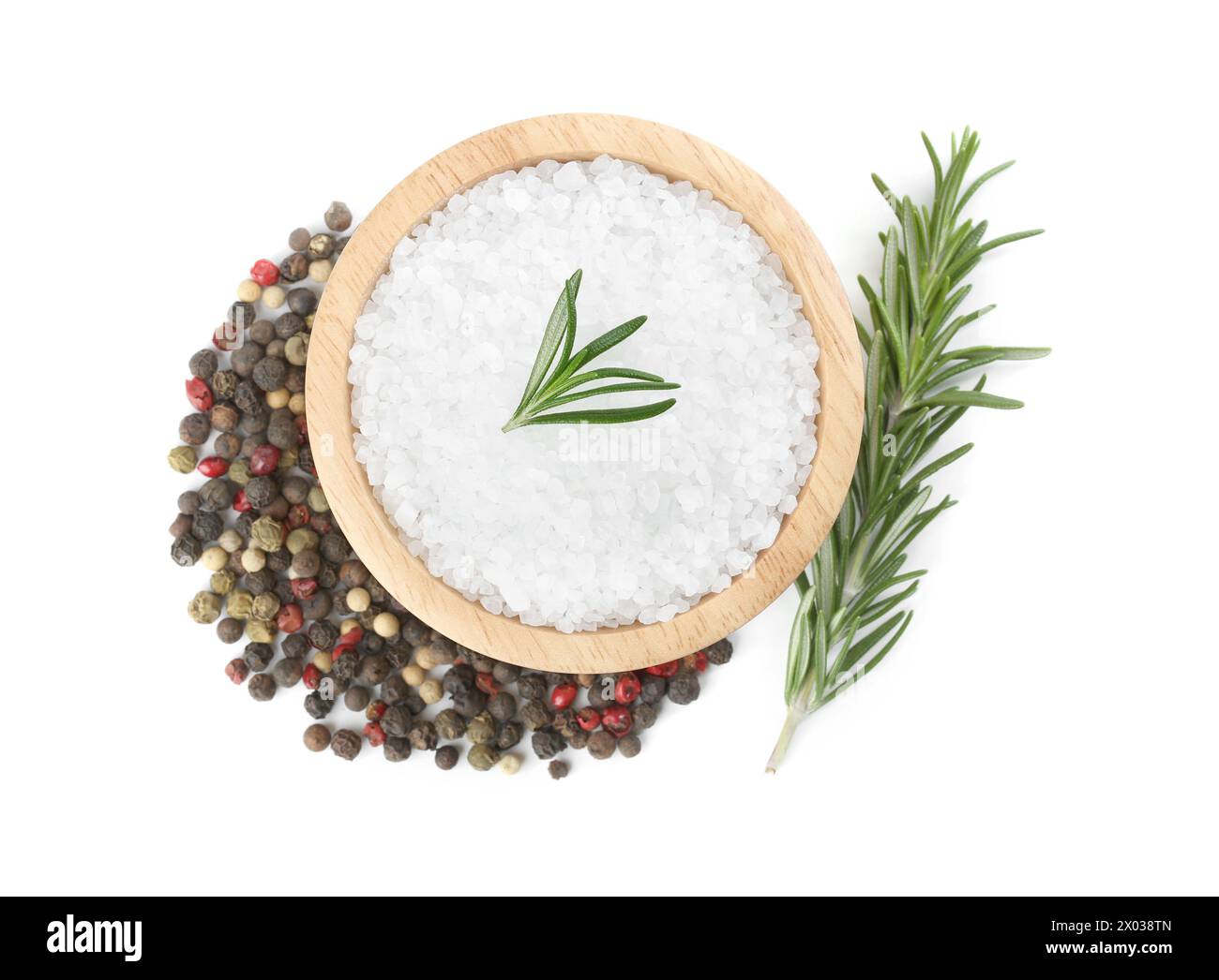 Salt with fresh rosemary in wooden bowl and peppercorns isolated on white, top view Stock Photo