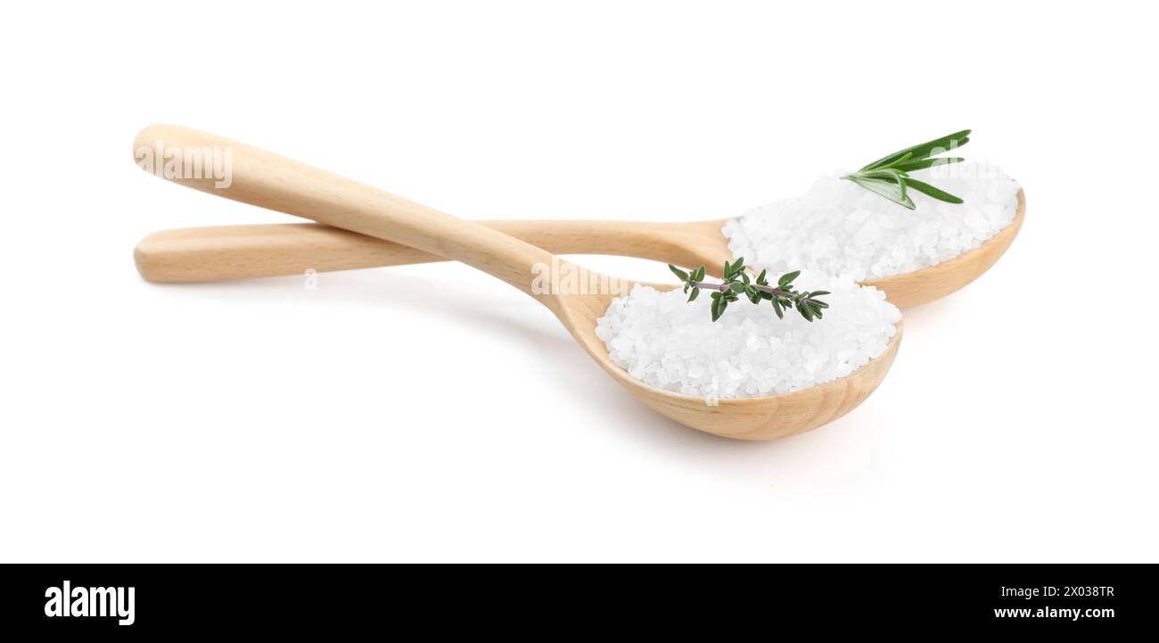 Salt with fresh rosemary and thyme in spoons isolated on white Stock Photo