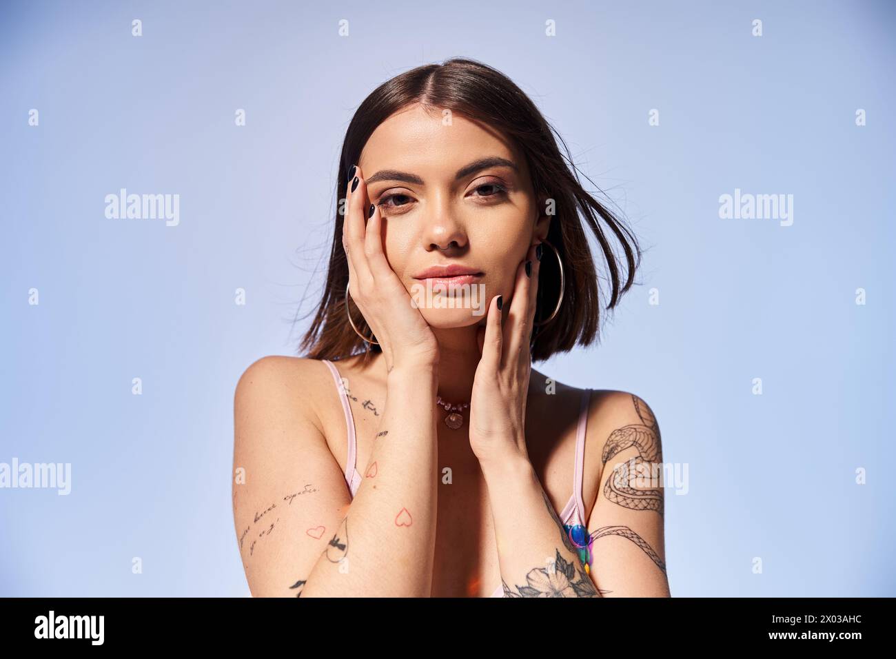 a-young-woman-with-brunette-hair-proudly-displays-a-tattoo-on-her-arm