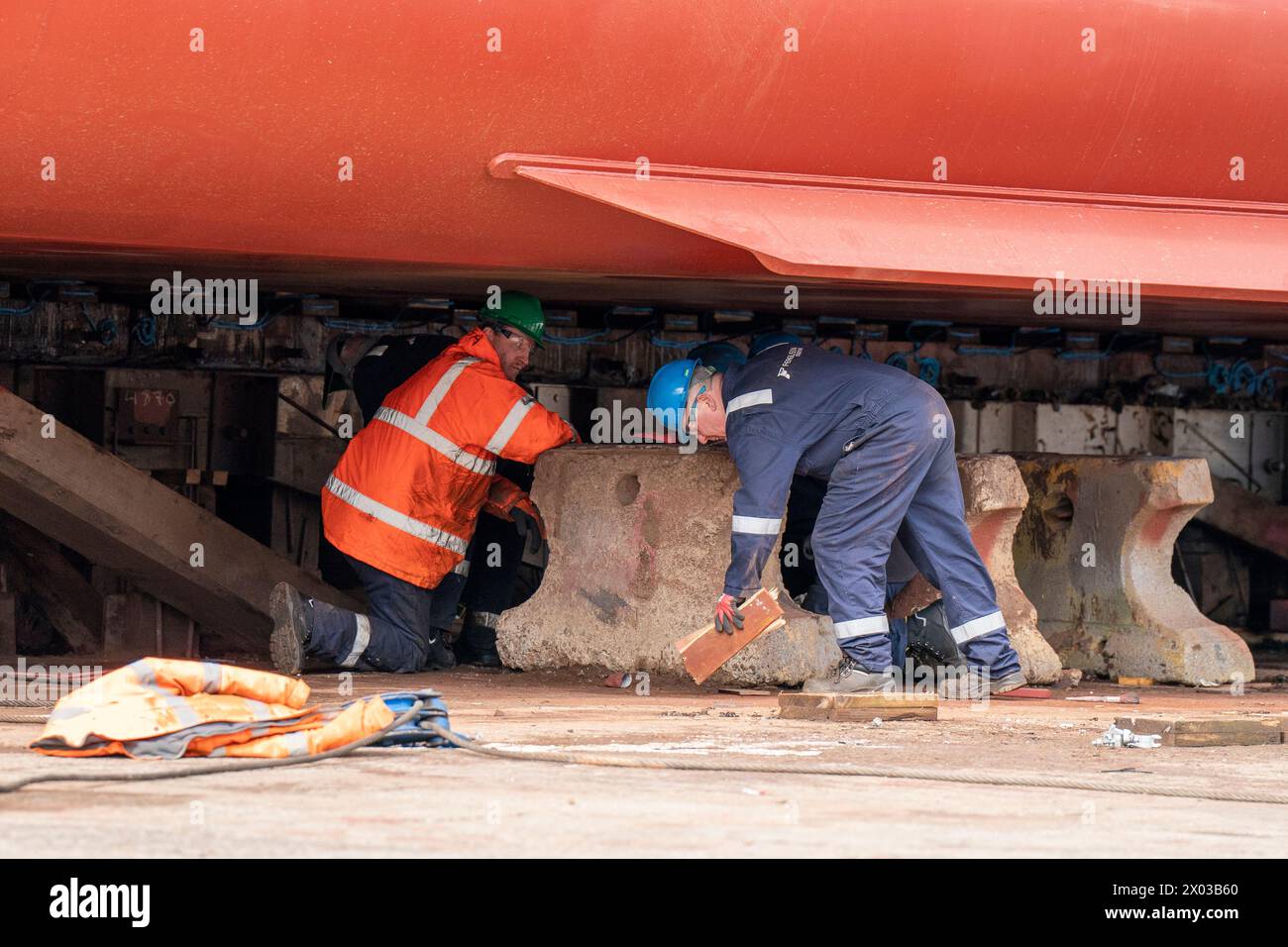 Workers make final preparations before the launch of the MV Glen Rosa at Ferguson Marine Port Glasgow shipyard, marking the first time the vessel will enter the water. Picture date: Tuesday April 9, 2024. Stock Photo