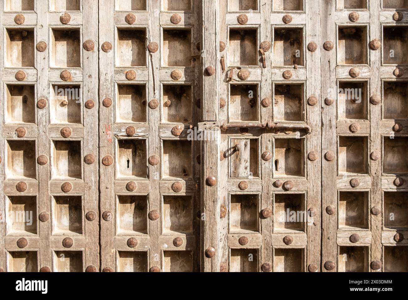 An Arab culture inspired elaborately carved door at the entrance to a building in Zanzibar, Tanzania. Stock Photo