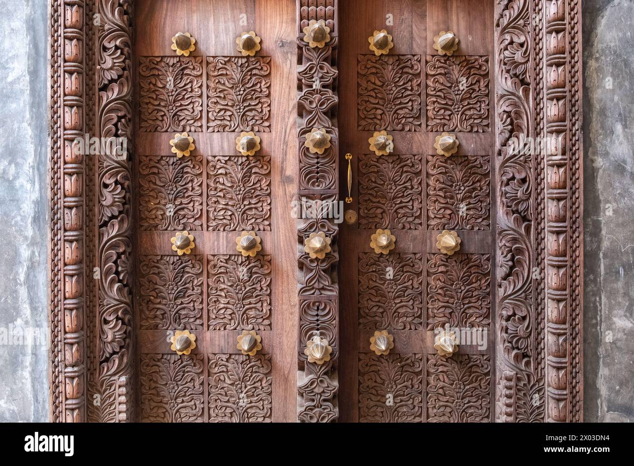 An Arab culture inspired elaborately carved door at the entrance to a building in Zanzibar, Tanzania. Stock Photo