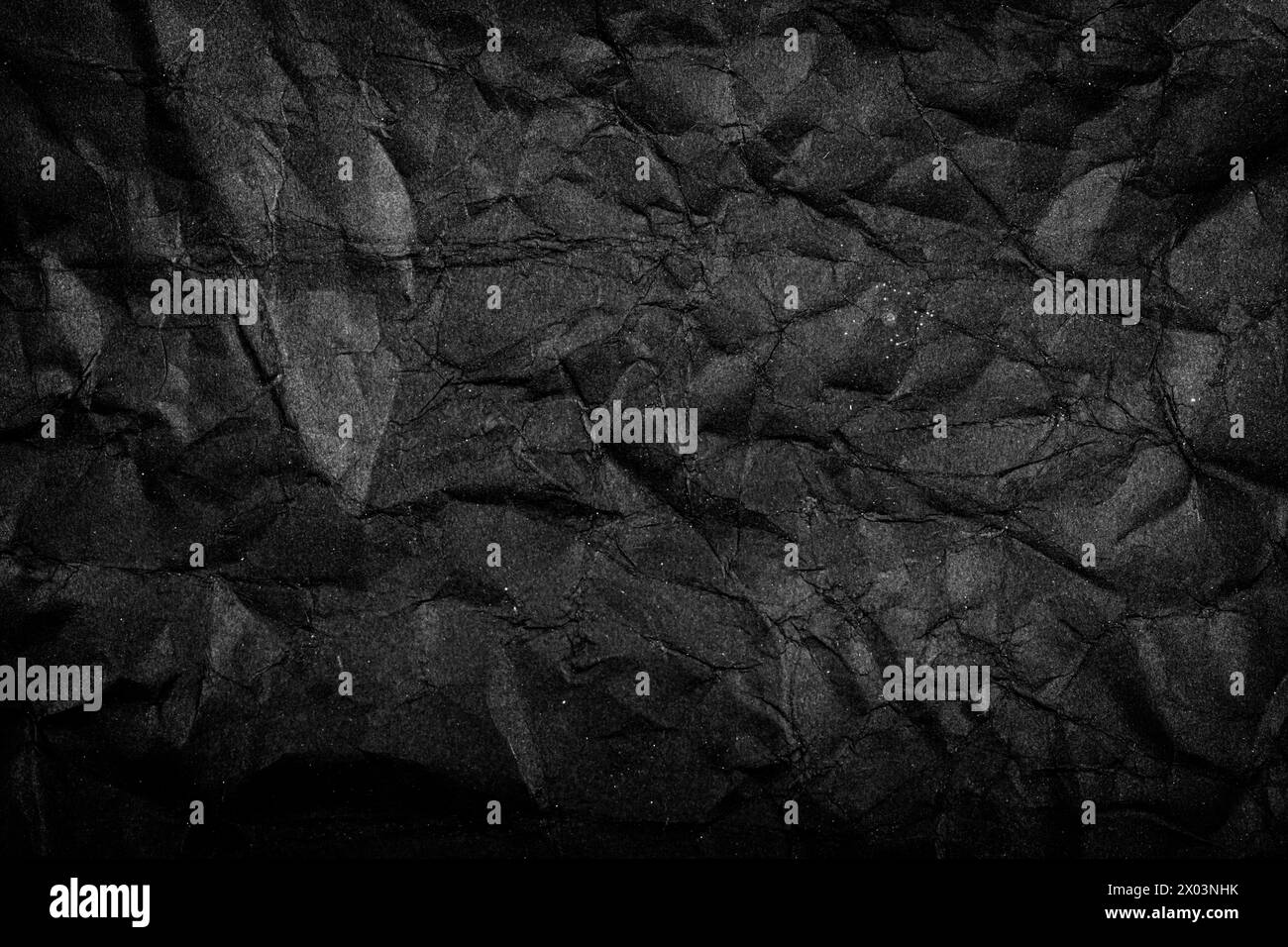 Black Paper Texture background. Crumpled Black paper abstract shape background. Stock Photo
