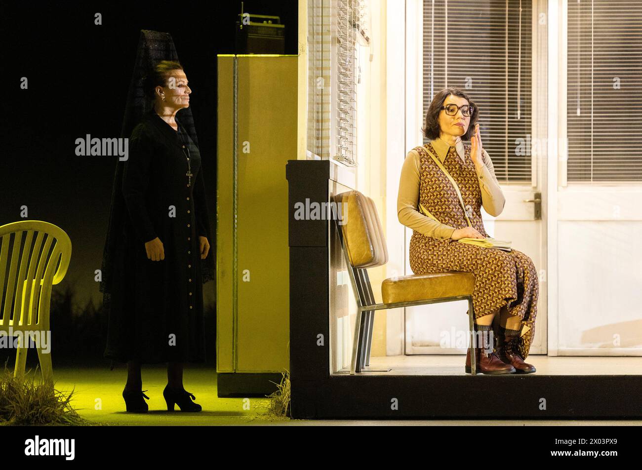 l-r: Ruth Alfie Adams (Mother of Don Jose), Olga Kulchynska (Micaela) in CARMEN at the Royal Opera House, Covent Garden, London WC2  05/04/2024 music: Georges Bizet  libretto: Henri Meilhac & Ludovic Halevy  dramaturg: Elisa Zaninotto  conductor: Antonello Manacorda  set design: Paulo Fantin  costumes: Carla Teti  lighting: Alessandro Carletti  director: Damiano Michieletto Stock Photo