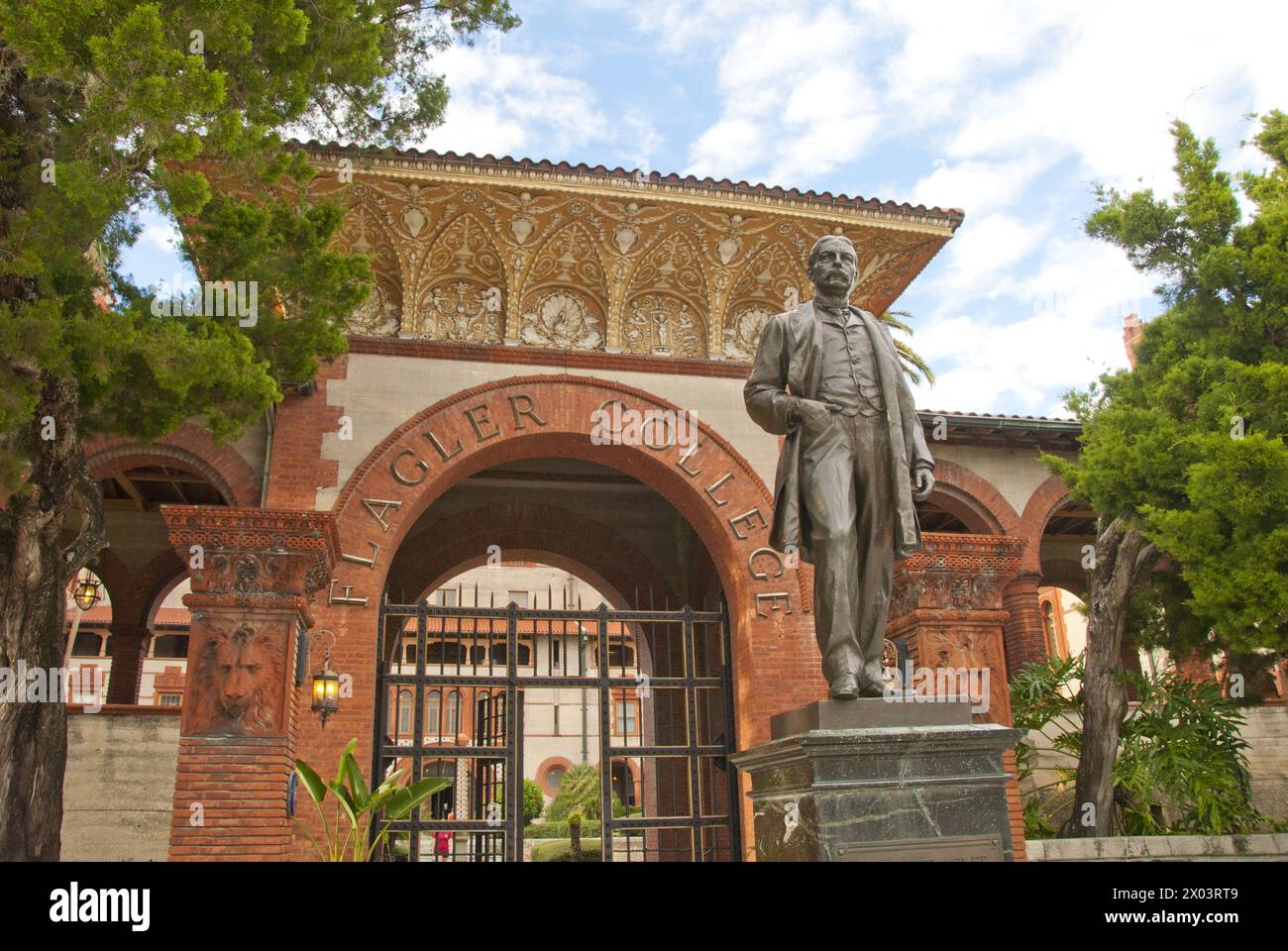 Henry Flagler statue stands in front of Flagler College, formerly Ponce de Leon Hotel, now a historic landmark was built in 1887 by Henry M. Flagler Stock Photo