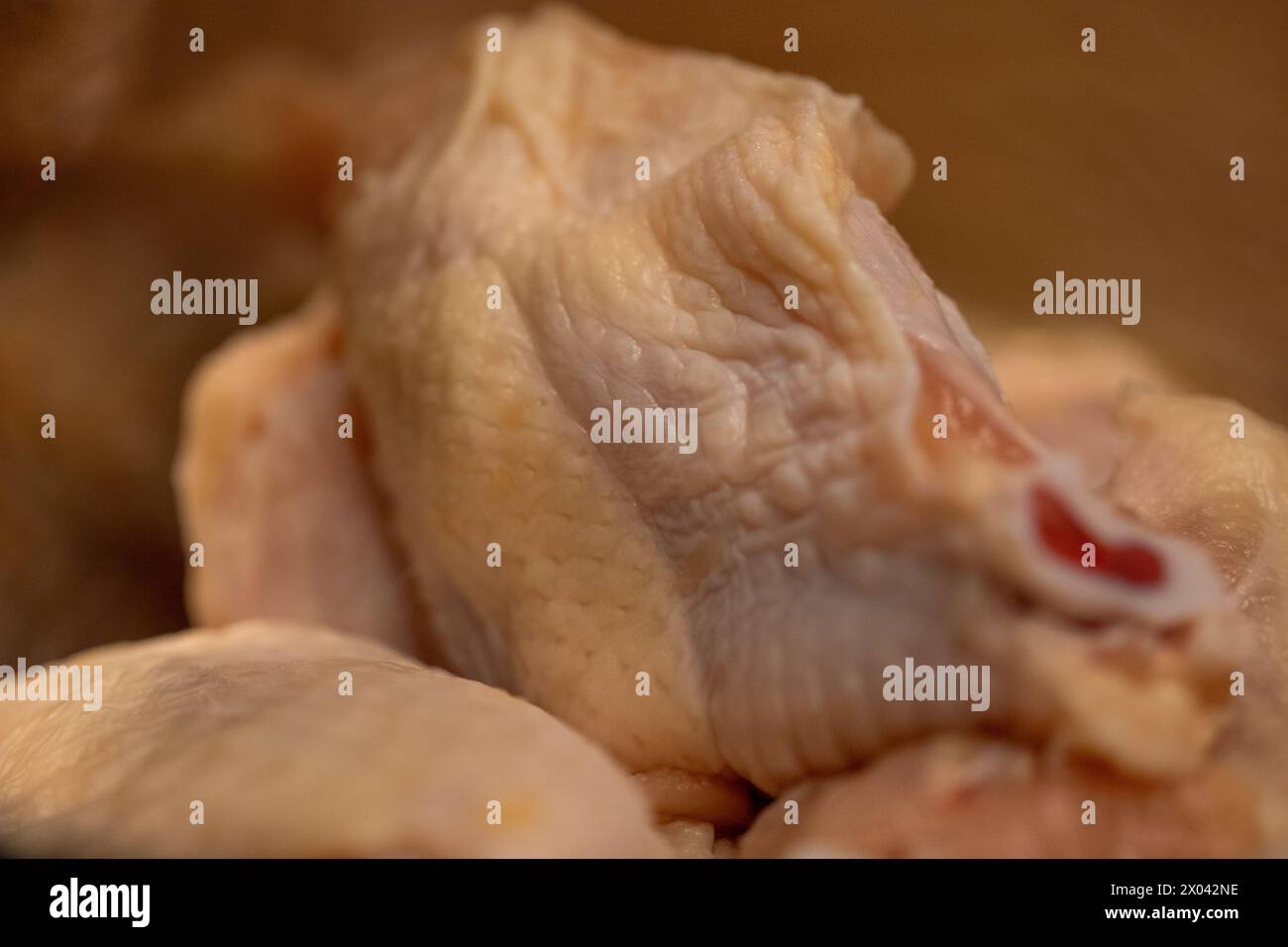 Unseasoned raw chicken wings to be fried Stock Photo