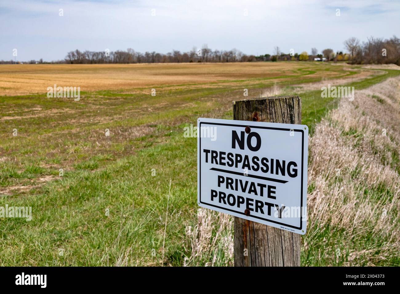 Van Wert, Ohio - A 'No Trespassing' sign protects a farm field in rural Northwestern Ohio. Stock Photo