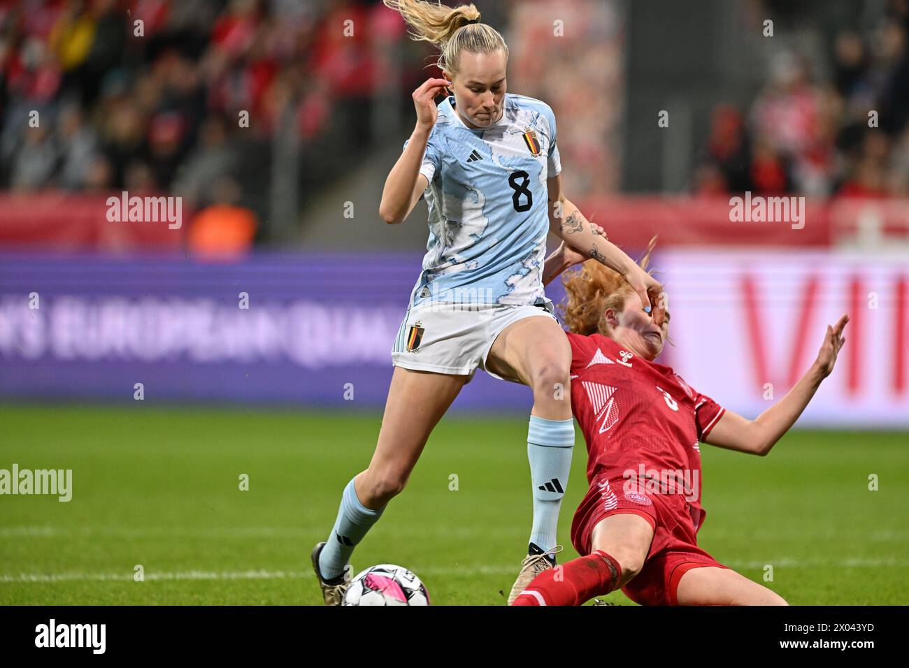 Viborg, Denmark. 09th Apr, 2024. Feli Delacauw (8) of Belgium fighting for the ball with Stine Ballisager (3) of Denmark during a soccer game between the national women teams of Denmark and Belgium, called the Red Flames on the second matchday in Group A2 in the league stage of the 2023-24 UEFA Women's European Qualifiers competition, on Tuesday 9 April 2024 in Viborg, Denmark . Credit: sportpix/Alamy Live News Stock Photo