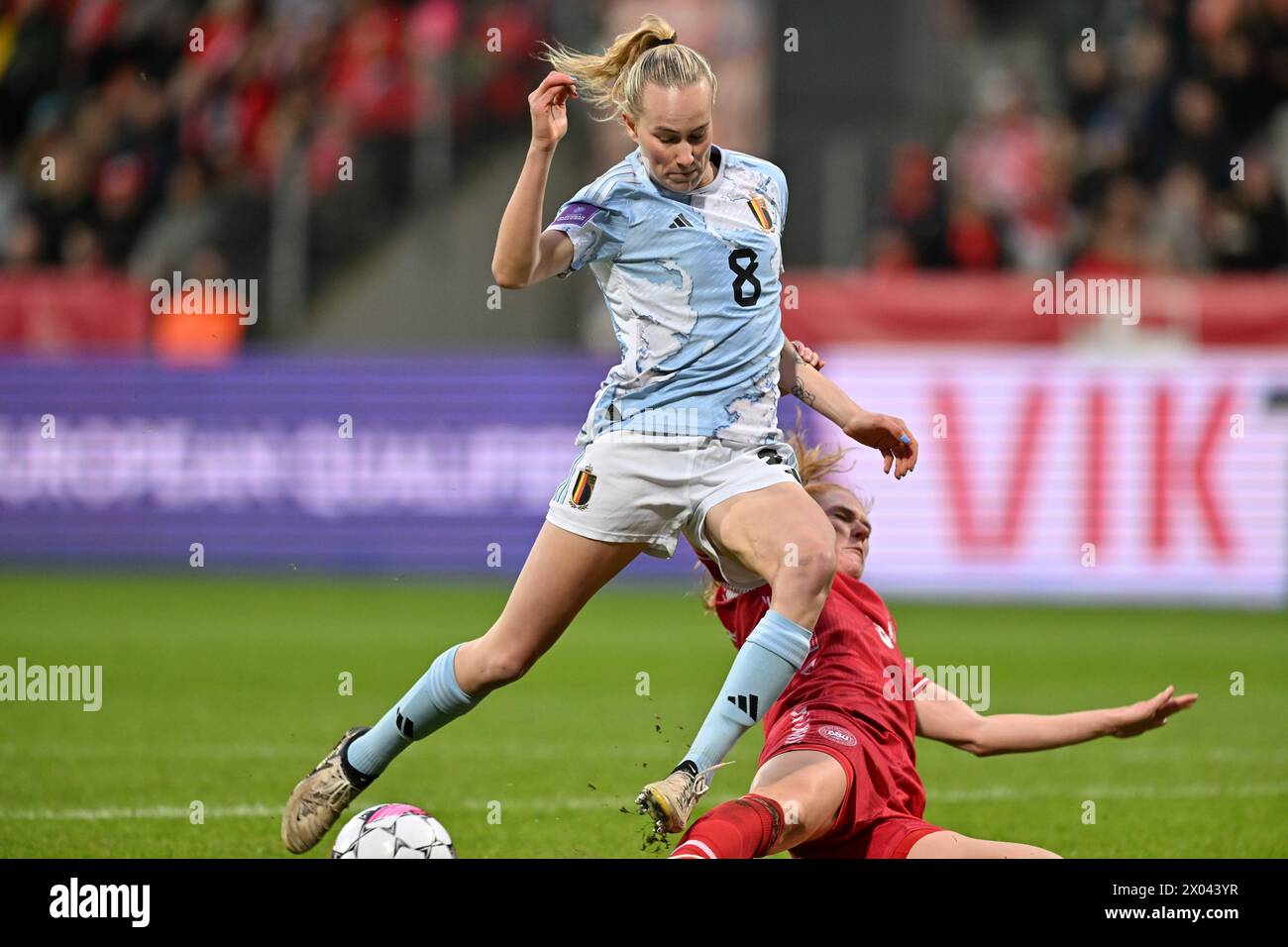 Viborg, Denmark. 09th Apr, 2024. Feli Delacauw (8) of Belgium fighting for the ball with Stine Ballisager (3) of Denmark during a soccer game between the national women teams of Denmark and Belgium, called the Red Flames on the second matchday in Group A2 in the league stage of the 2023-24 UEFA Women's European Qualifiers competition, on Tuesday 9 April 2024 in Viborg, Denmark . Credit: sportpix/Alamy Live News Stock Photo