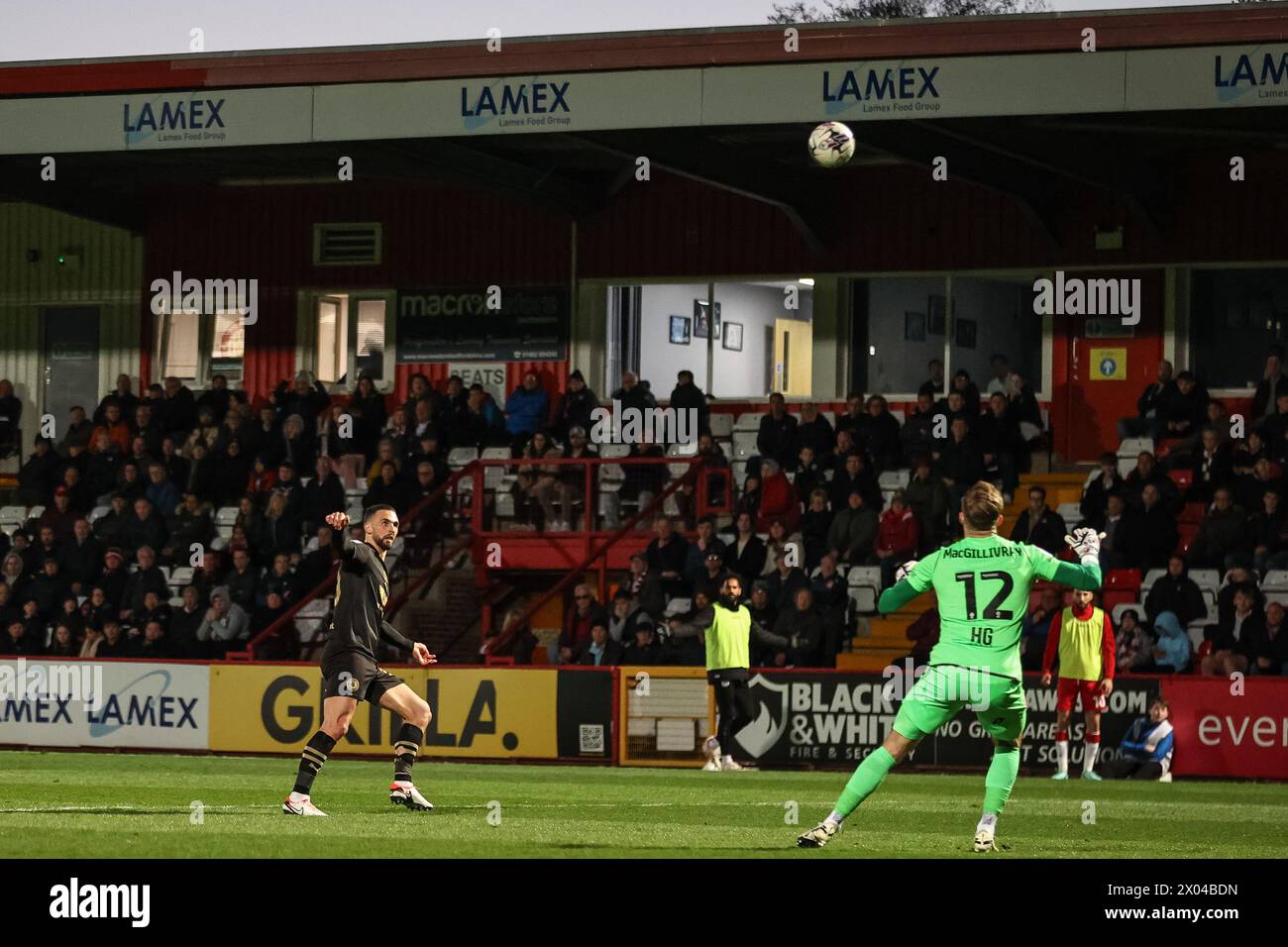 Adam Phillips of Barnsley lobs Craig MacGillivray of Stevenage to score a goal and make it 0-1 during the Sky Bet League 1 match Stevenage vs Barnsley at Lamex Stadium, Stevenage, United Kingdom, 9th April 2024  (Photo by Mark Cosgrove/News Images) Stock Photo