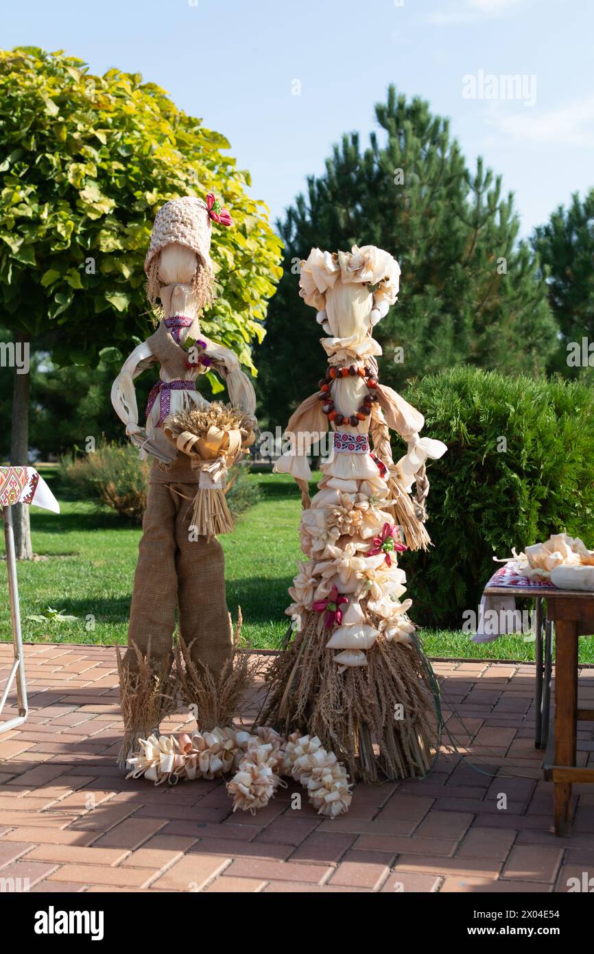 Handmade Corn husk doll. The figure of men and women is richly decorated. Symbols of wealth and fertility, amulets for the home, keepers of the hearth Stock Photo