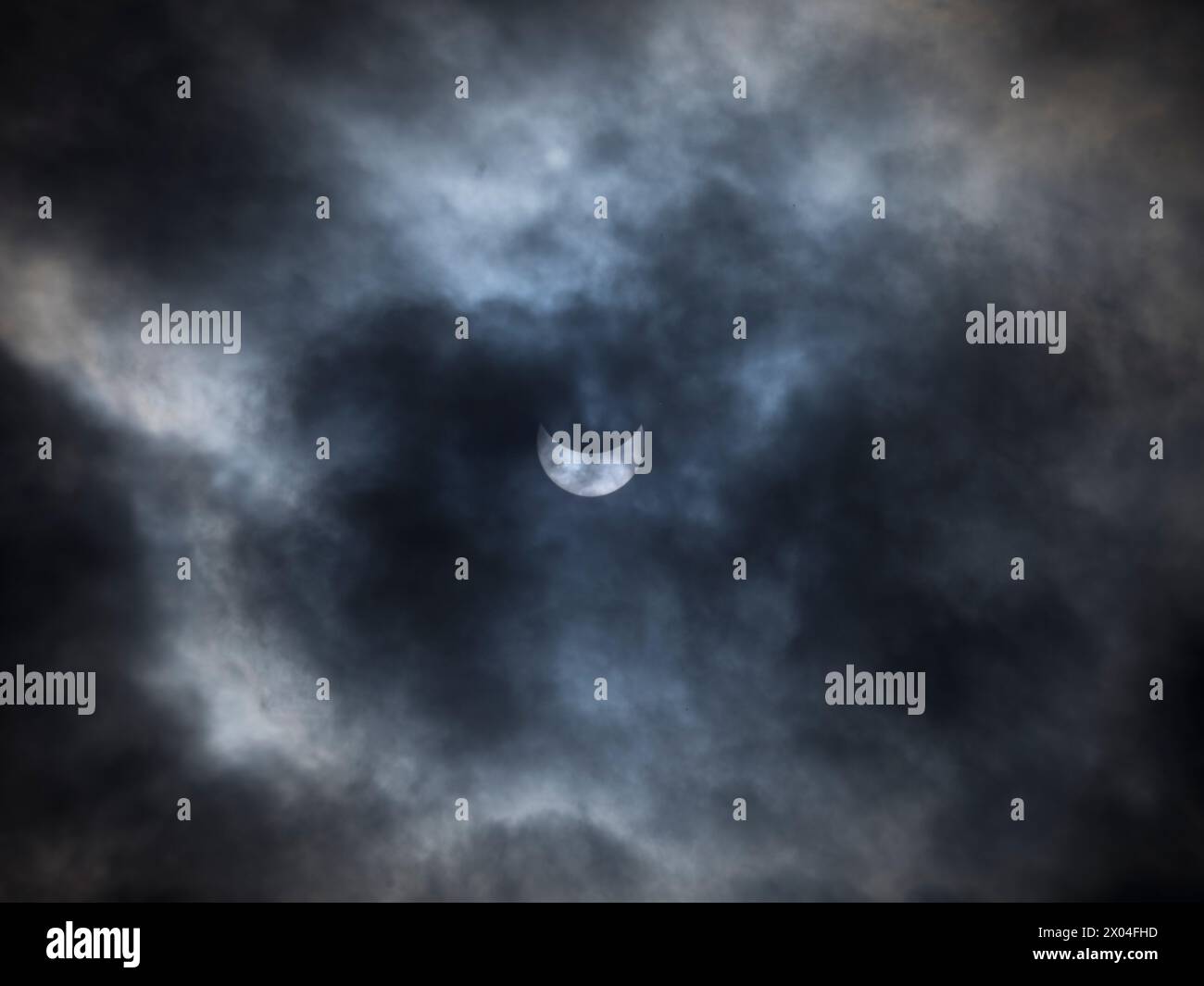 Solar Eclipse With Clouds, Lancaster Pennsylvania USA Stock Photo