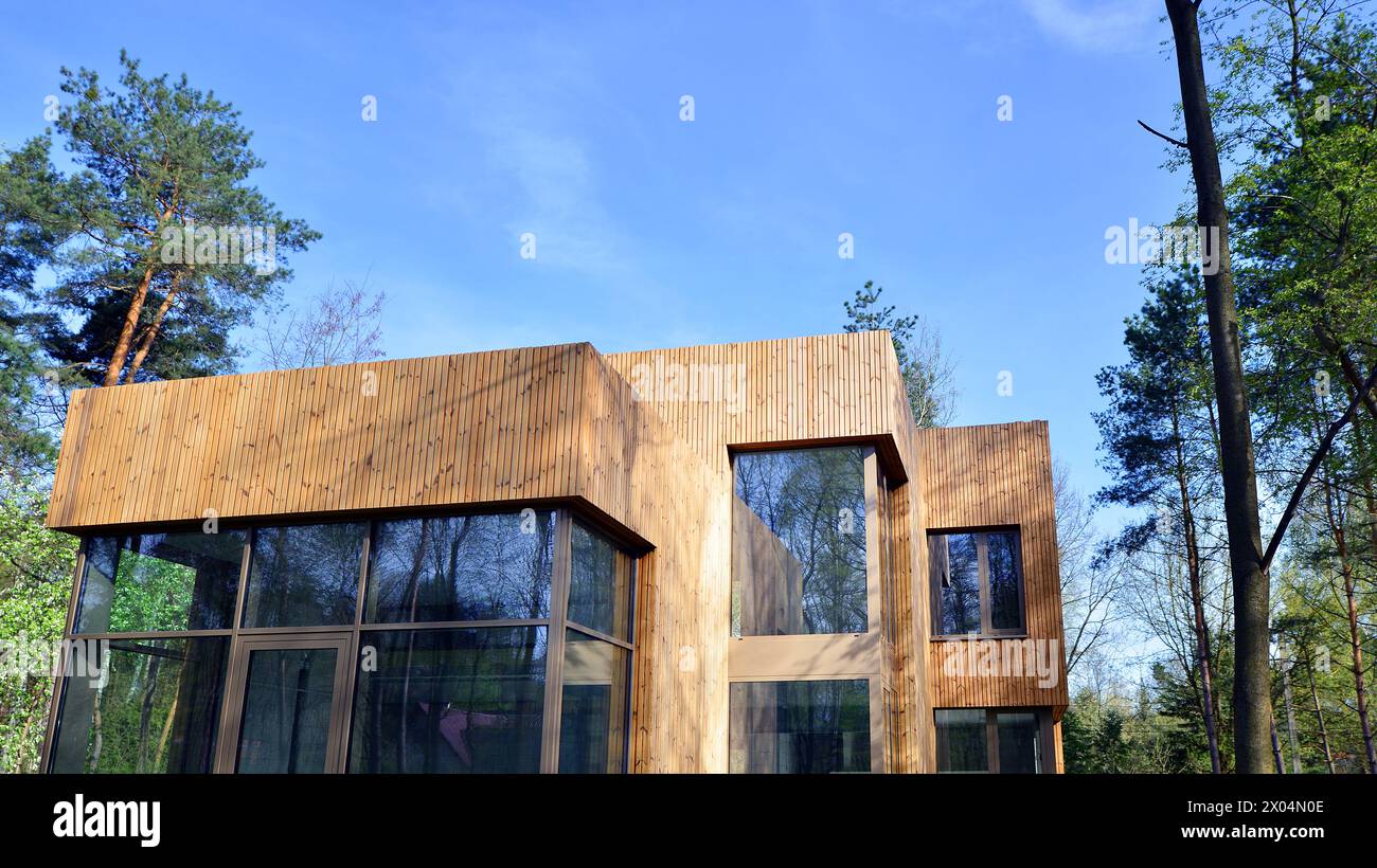 New single family house. Residential home with modern wooden facade ...
