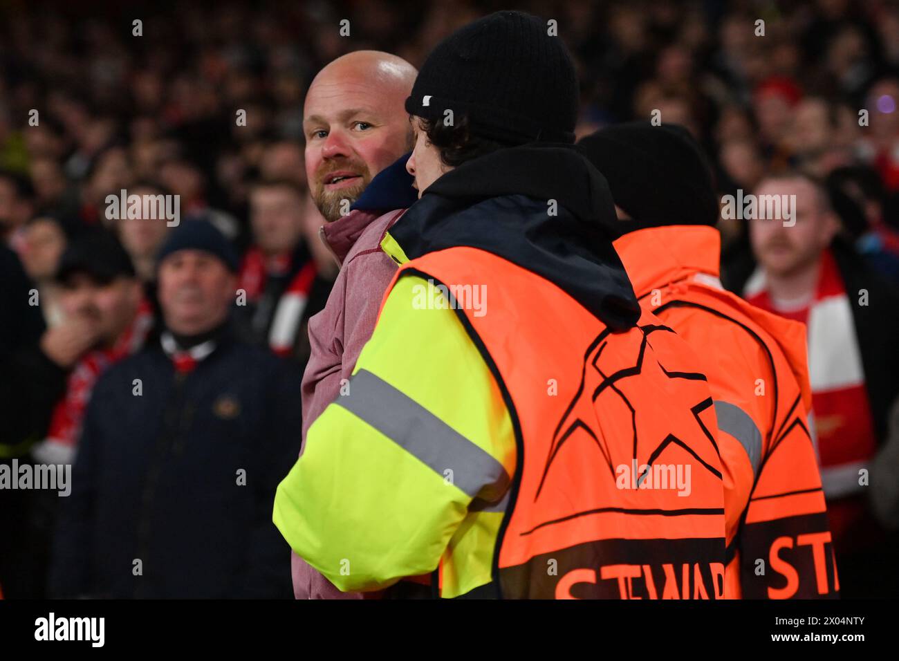 Bayern Munich fans is removed from the ground by security during the UEFA Champions League Quarter-Final (1st leg) football match between Arsenal FC and Bayern Munich at the Emirates Stadium in London, England. (Will Palmer/SPP/ATP Images) Credit: SPP Sport Press Photo. /Alamy Live News Stock Photo