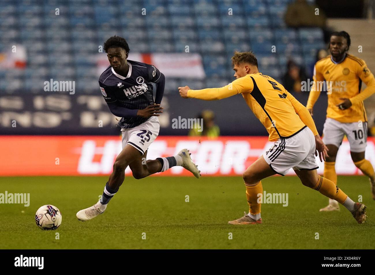 London, UK. 09th Apr, 2024. Romain Esse of Millwall under pressure from Callum Doyle of Leicester City during the Millwall FC v Leicester City FC sky bet EFL Championship match at The Den, London, England, United Kingdom on 9 April 2024 Credit: Every Second Media/Alamy Live News Stock Photo