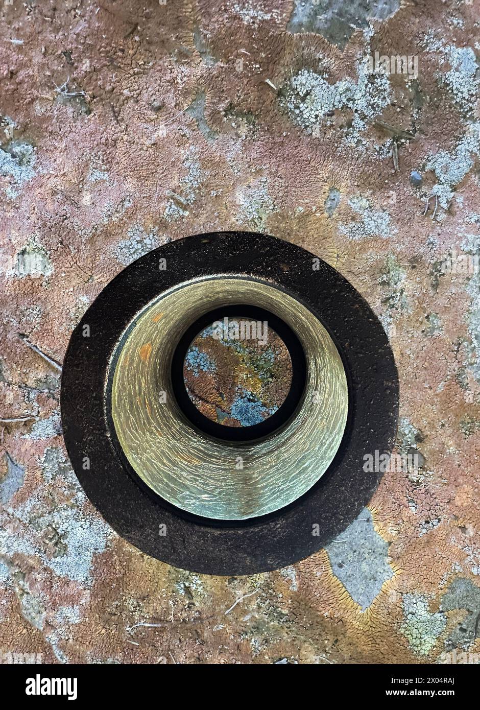 See through an eye on the world in this composite. You are looking at ground space earth cover through a round geometric circular funnel shape scope. Stock Photo