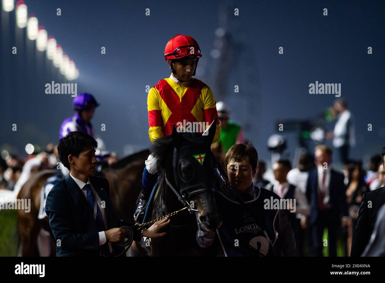 Justin Palace and Joao Moreira head to the start for the Group 1 Longines Dubai Sheema Classic, Meydan, 30/03/24. Credit JTW Equine Images / Alamy. Stock Photo