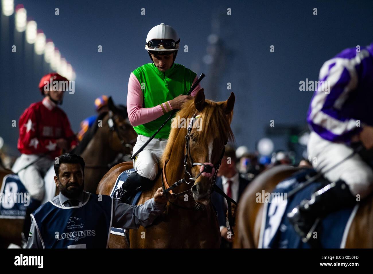 Sisfahan and Lukas Delozier head to the start for the 2024 Group 1 Longines Dubai Sheema Classic, Dubai, 30/03/24. Credit JTW Equine Images / Alamy. Stock Photo