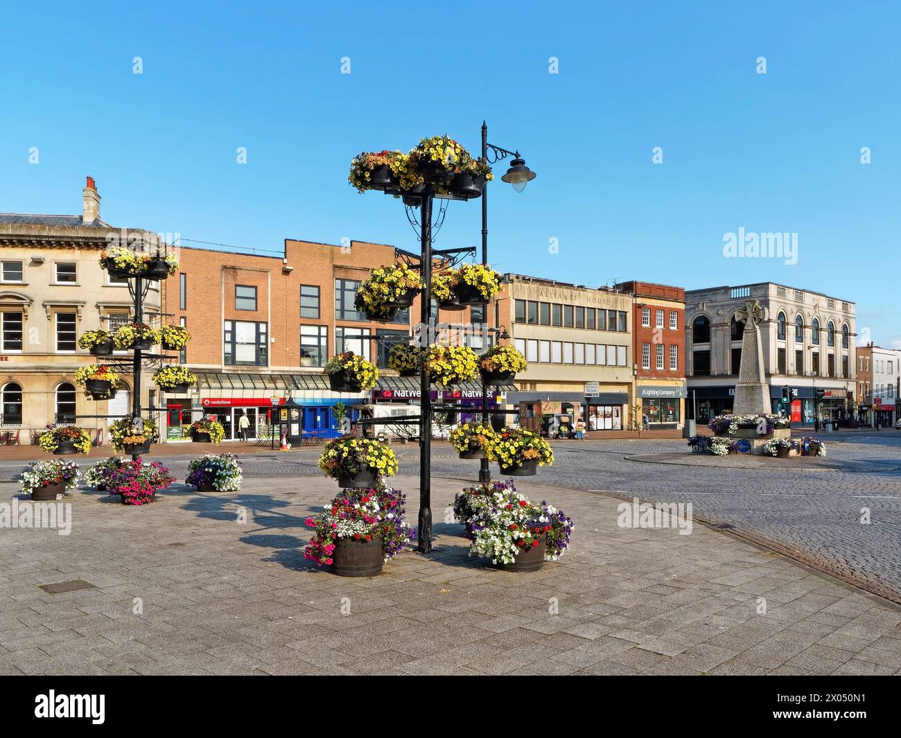 UK, Somerset, Taunton, The Parade, Hanging Baskets and Burma War Memorial. Stock Photo