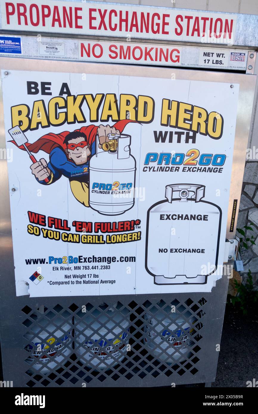 Outside propane tank cage decorated with a caped superhero. St Paul Minnesota MN USA Stock Photo