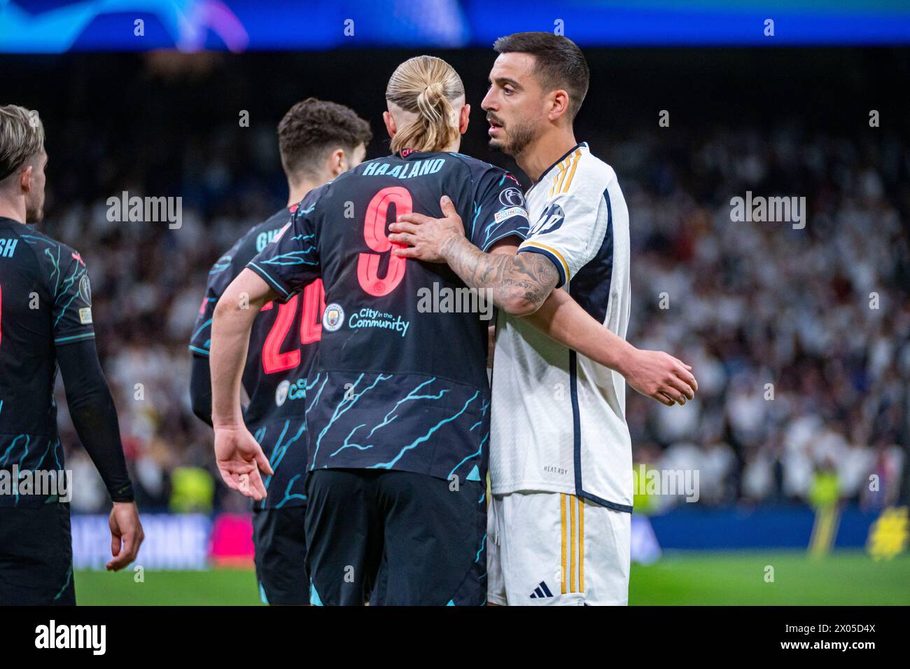 Madrid, Madrid, Spain. 9th Apr, 2024. Jose Luis Sanmartin Mato (Joselu) of Real Madrid (R) hugs Erling Haaland of Manchester City (L) during the UEFA Champions League quarter-final first leg match between Real Madrid CF and Manchester City at Estadio Santiago Bernabeu on April 9, 2024 in Madrid, Spain. (Credit Image: © Alberto Gardin/ZUMA Press Wire) EDITORIAL USAGE ONLY! Not for Commercial USAGE! Stock Photo