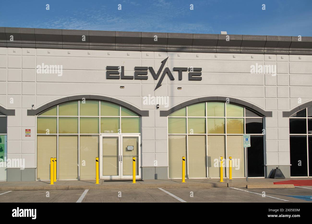 Houston, Texas USA 04-07-2024: Elevate apparel business storefront exterior clothing store company retail parking lot, Houston TX USA. Stock Photo