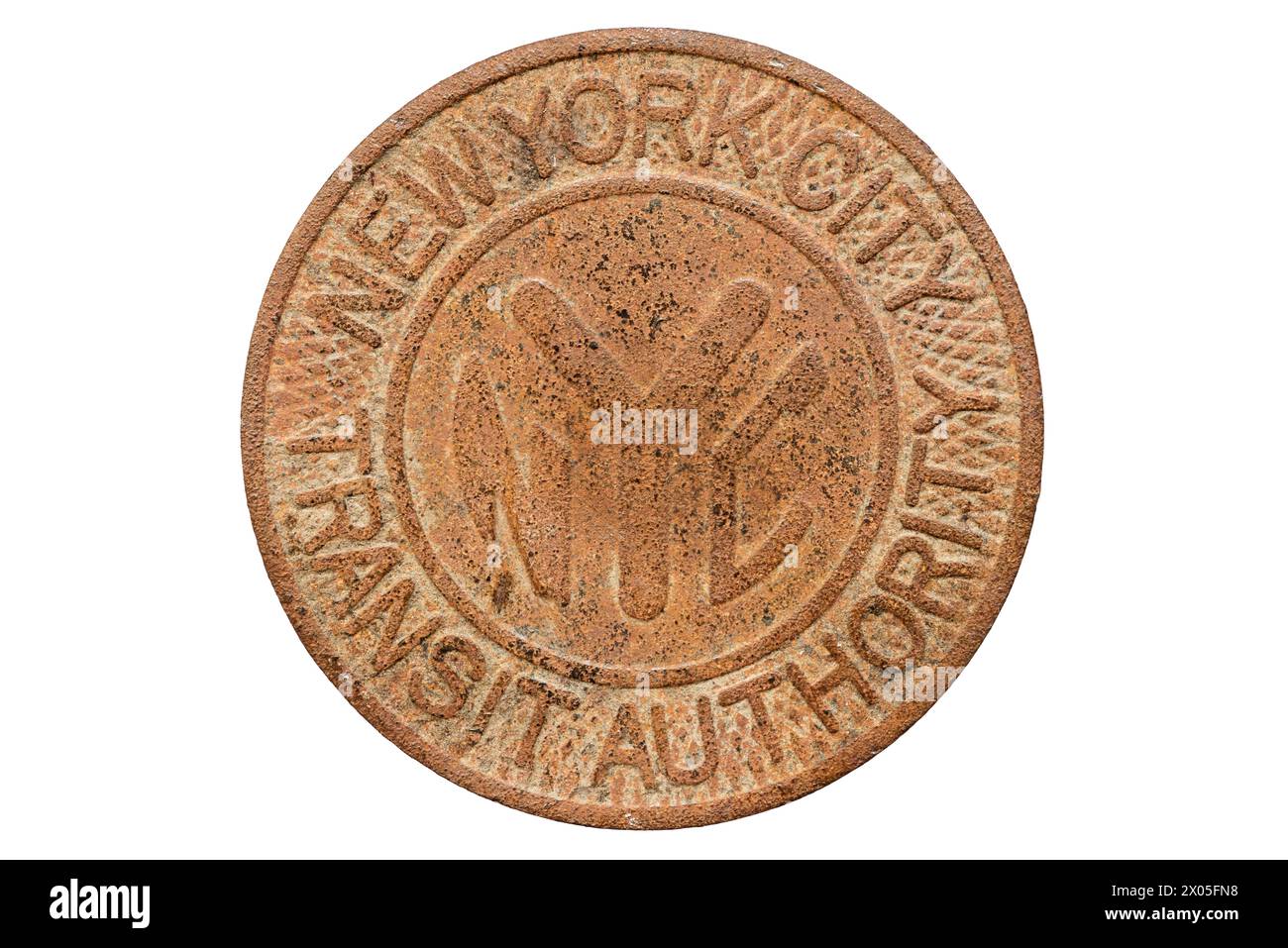 used corroded solid brass New York City Transit Authority subway token from 1980 to 1985  isolated on white Stock Photo