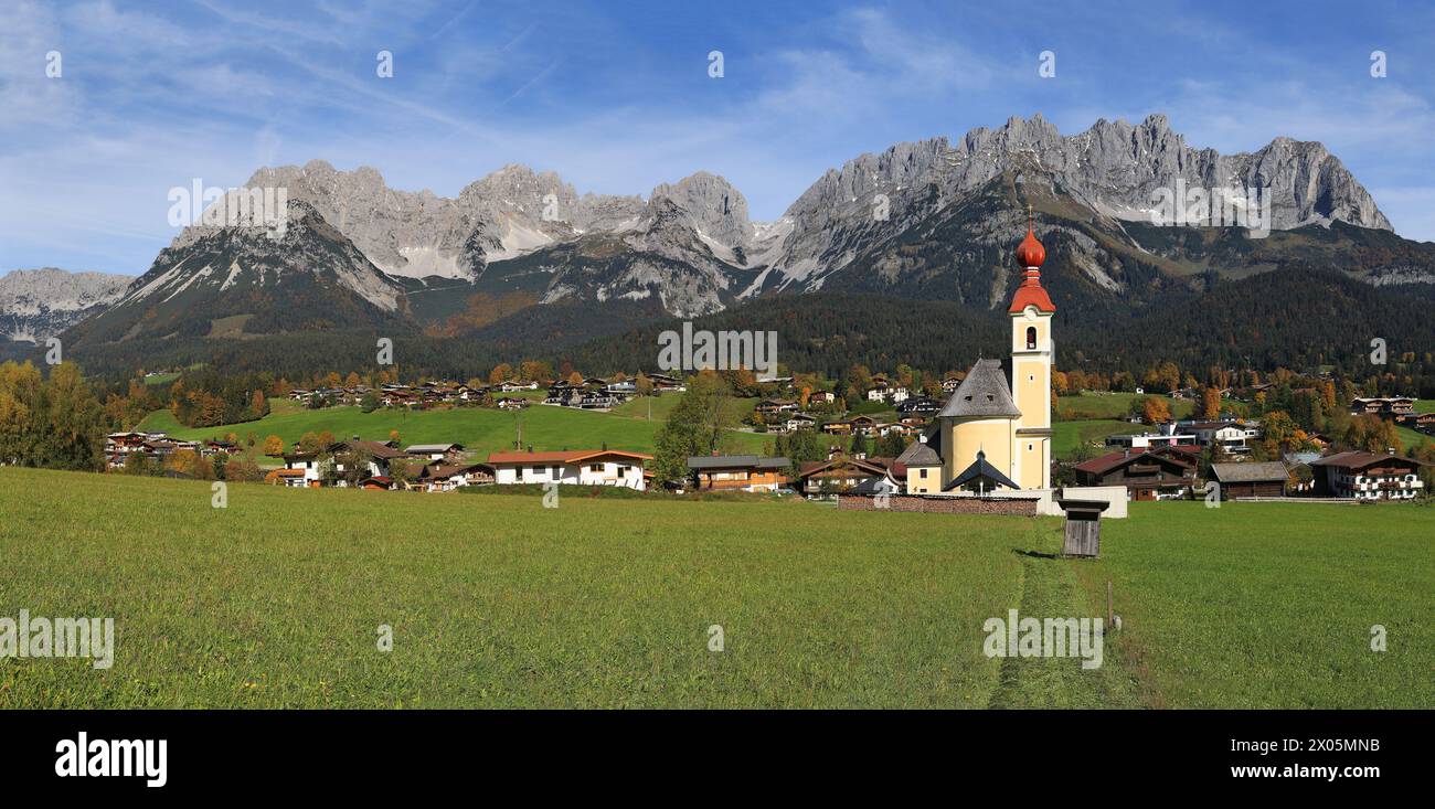 The parish church at the Going village with the famous mountain Wilder Kaiser at the background, Tirol, Austria Stock Photo