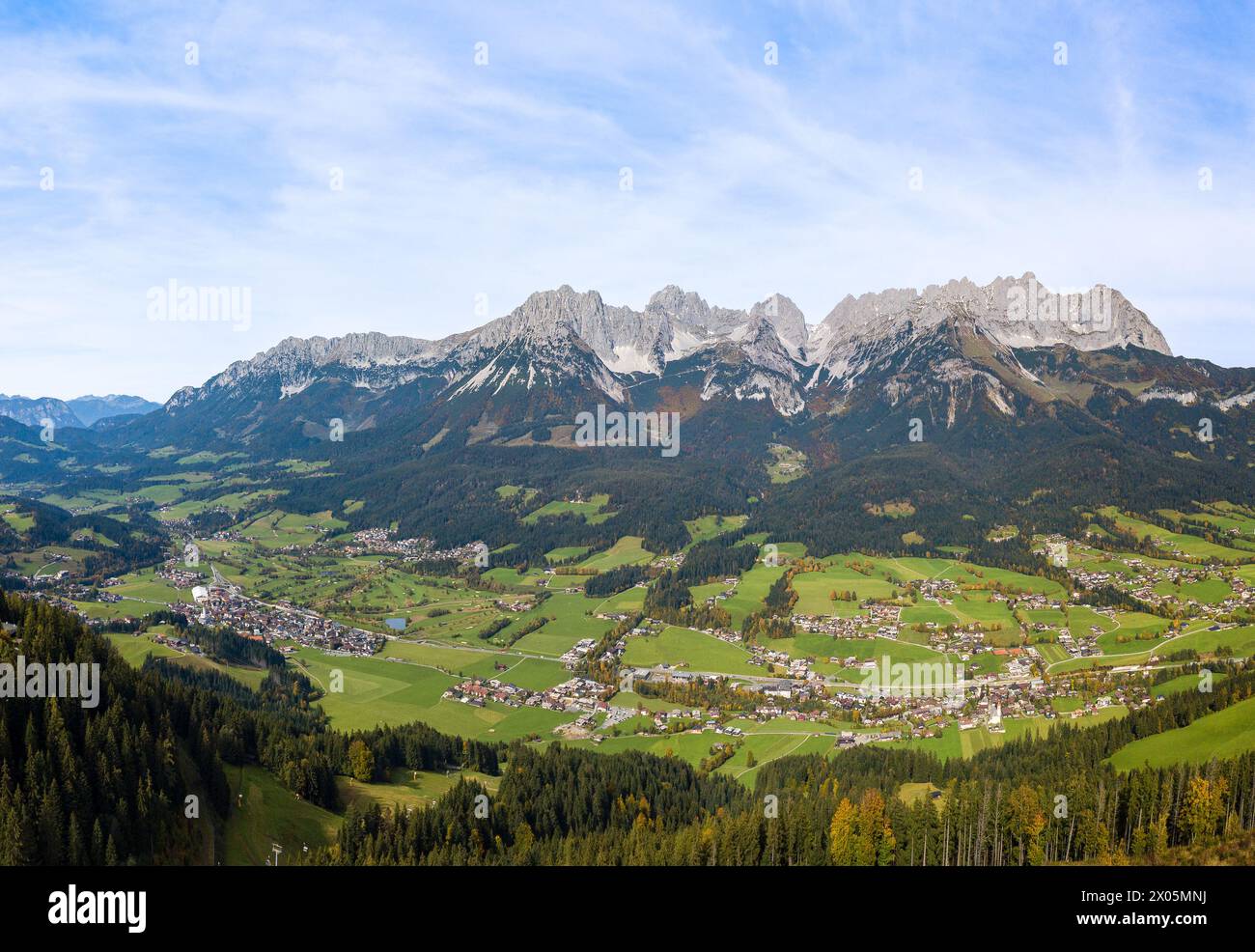 Aerial panorama image of the Wilder Kaiser mountain range and the villages in the valley, Tirol, Austria Stock Photo