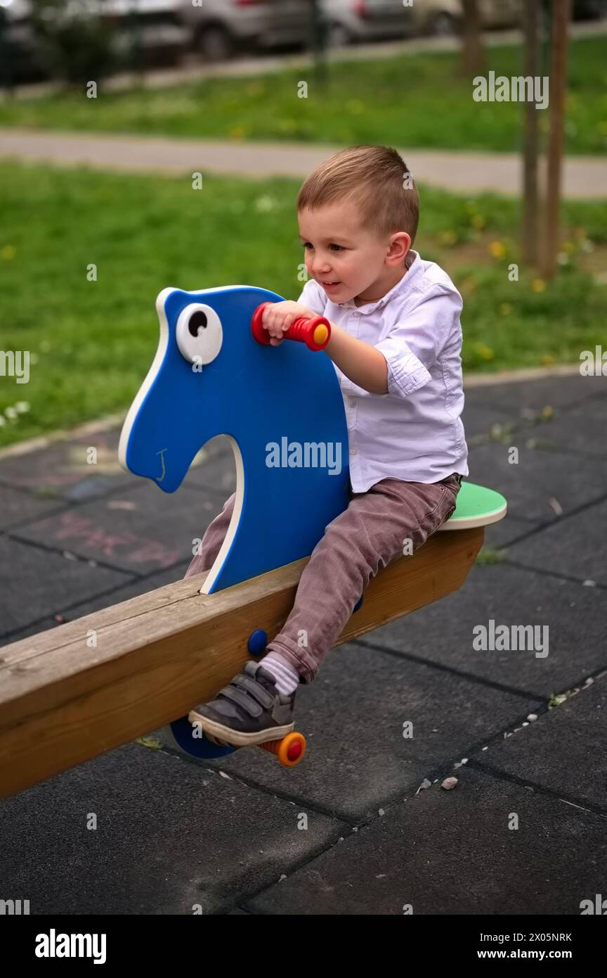 Portrait of little toddler on playground Stock Photo