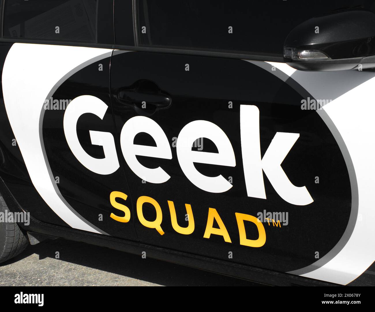 Ocala, FL 4-9-2024 Sign advertisement for Best Buy store Geek Squad repair van truck car in parking lot for at home technical support or electronics d Stock Photo