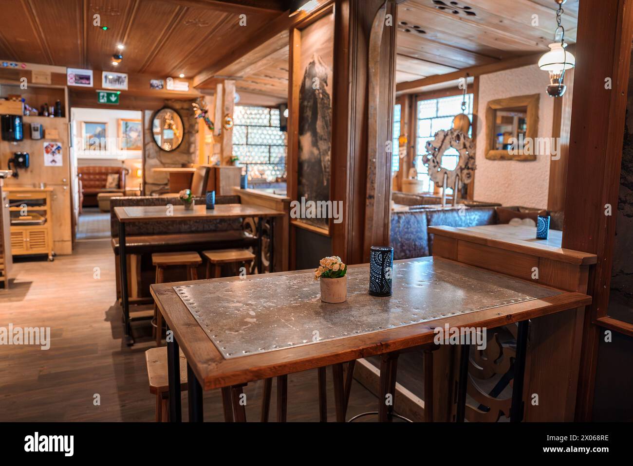 Cozy, rustic restaurant interior with alpine cabin vibe in mountainous ...