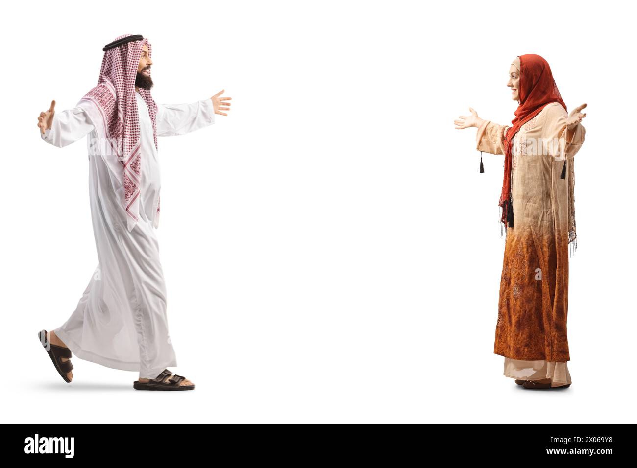 Full length profile shot of a saudi arab man meeting a woman wearing hijab isolated on white background Stock Photo